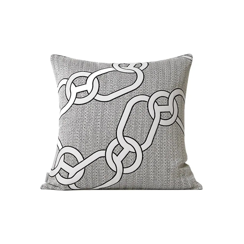 Housse de Coussin Couleur Blanc et gris clair avec motif de chaînes entrelacées blanches, sur fond à texture en chevrons - version chaines a broderie noire, de face