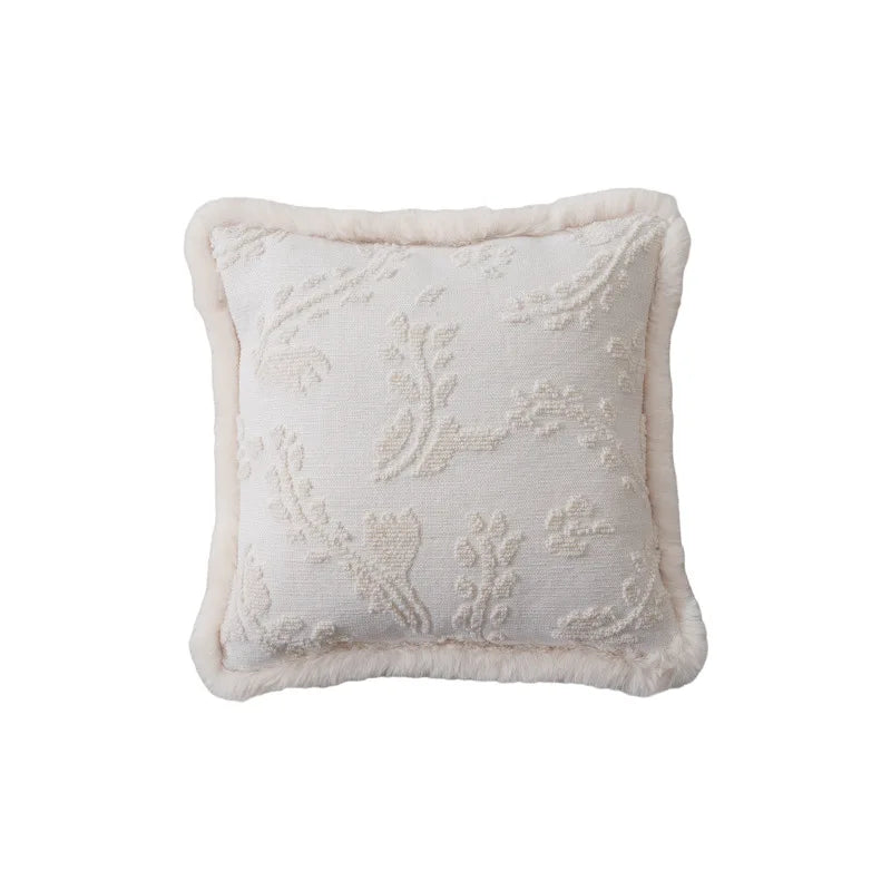 Housse de Coussin Blanc Brodé 45x45 décoratif avec des motifs floraux en relief, de couleur blanche ou ivoire, en tissu texturé avec bordure douce et moelleuse - de face