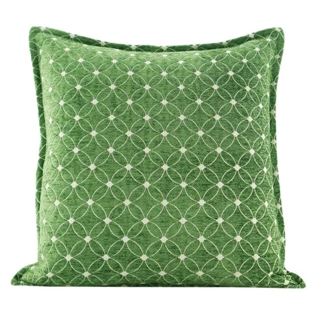 Housse de Coussin 50x50 Vert et Blanc avec un motif circulaire blanc entrecroisé, placé contre un fond blanc - de face